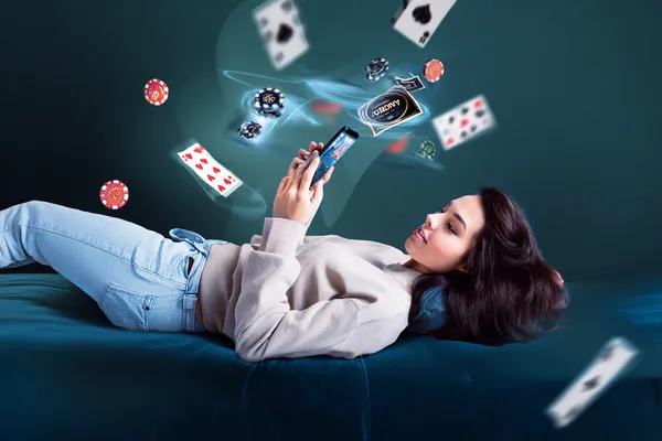 A cheerful woman in traditional clothing using her smartphone during a festive moment, showing how easily the 21GAME app fits into everyday life.