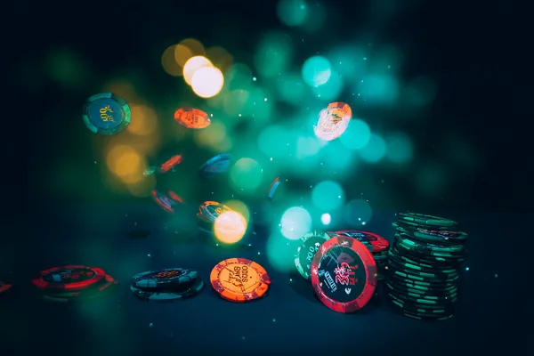 A professional dealer in a tuxedo greeting players at the roulette table, symbolizing the authentic live casino feel at 21GAME.