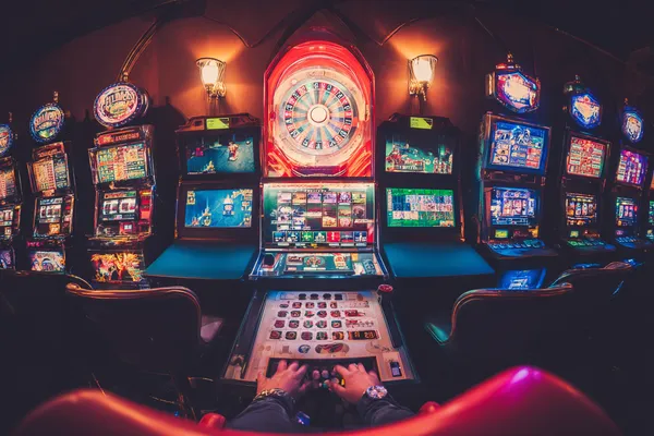 A close-up shot of golden coins falling around a spinning roulette wheel, representing immersive casino action at 21GAME.