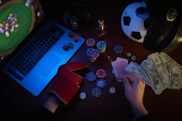 A glowing roulette wheel with cascading chips, symbolizing the engaging live and instant-win games available on 21GAME.